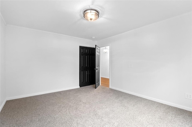 carpeted spare room with ornamental molding