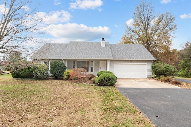 single story home featuring a garage and a front yard