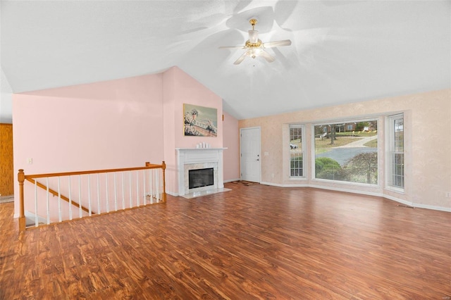 unfurnished living room with hardwood / wood-style floors, ceiling fan, lofted ceiling, and a premium fireplace