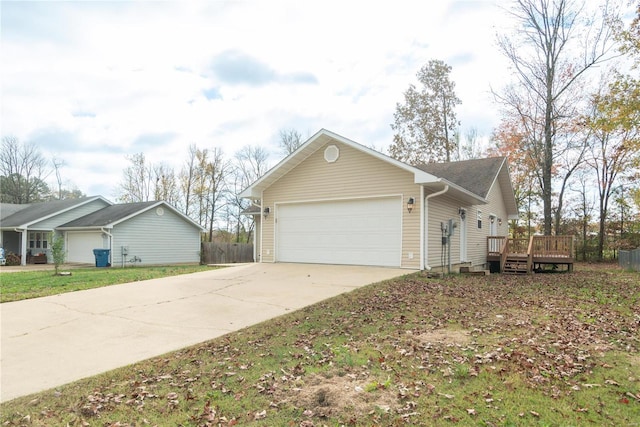 view of home's exterior featuring a deck and a garage