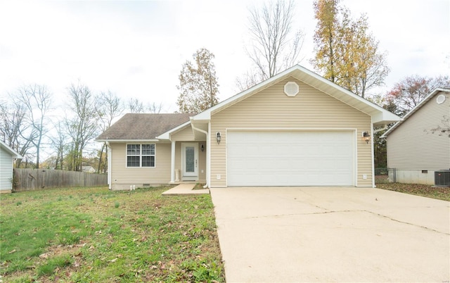 ranch-style home featuring cooling unit, a garage, and a front lawn