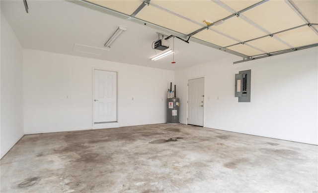 garage featuring a garage door opener, electric panel, and water heater