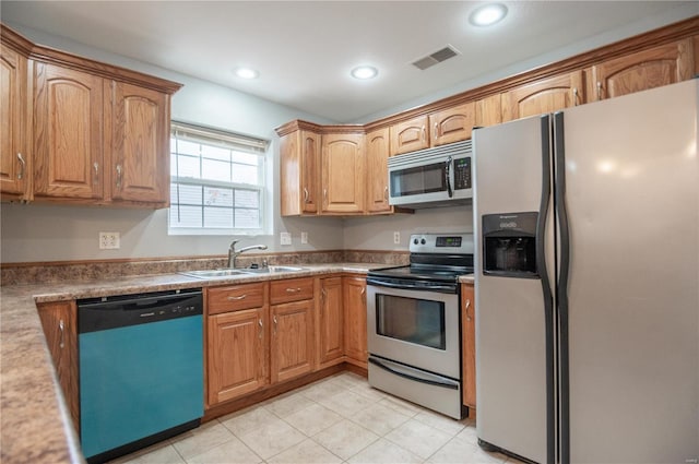 kitchen with appliances with stainless steel finishes and sink