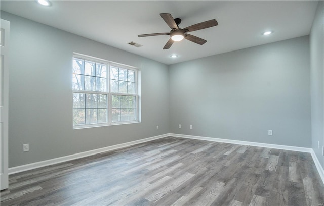 empty room with wood-type flooring and ceiling fan