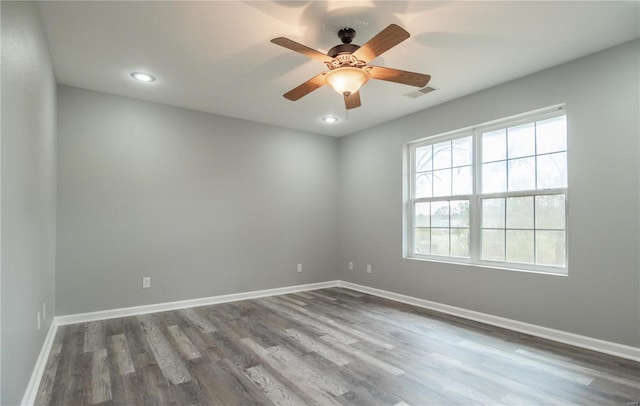 unfurnished room with hardwood / wood-style floors and ceiling fan