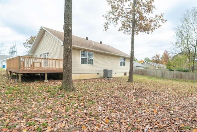 view of property exterior featuring cooling unit and a wooden deck