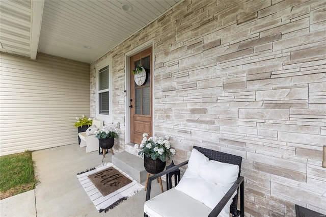 doorway to property with a porch