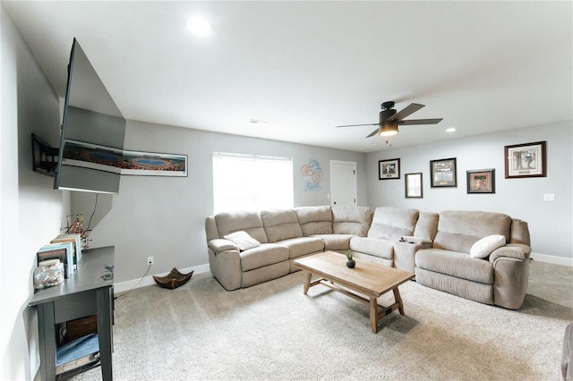 living room featuring carpet and ceiling fan