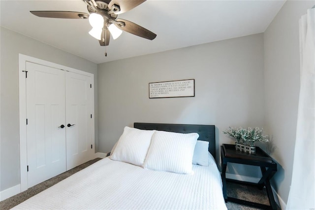 bedroom featuring ceiling fan, a closet, and carpet