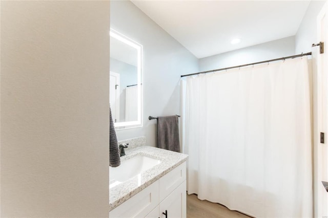 bathroom featuring vanity and wood-type flooring