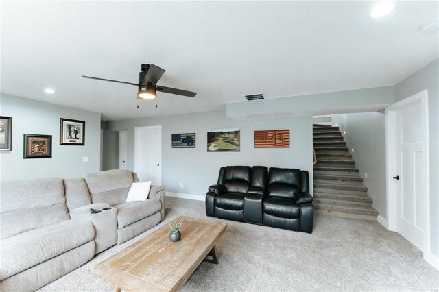 living room featuring light carpet and ceiling fan