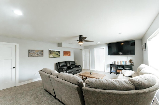 living room featuring carpet floors and ceiling fan