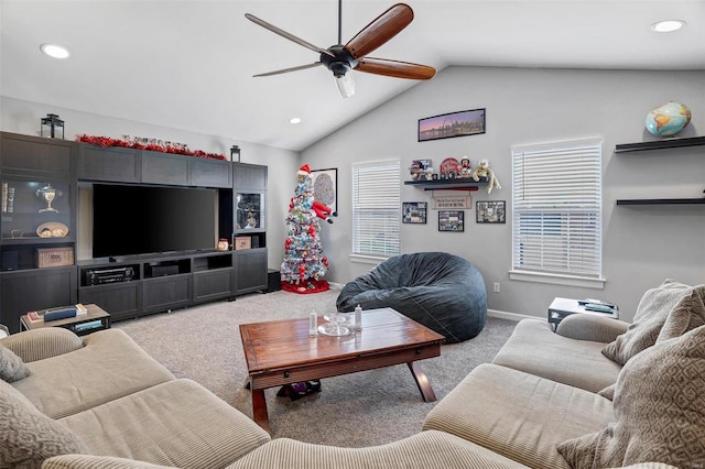 carpeted living room with lofted ceiling and ceiling fan