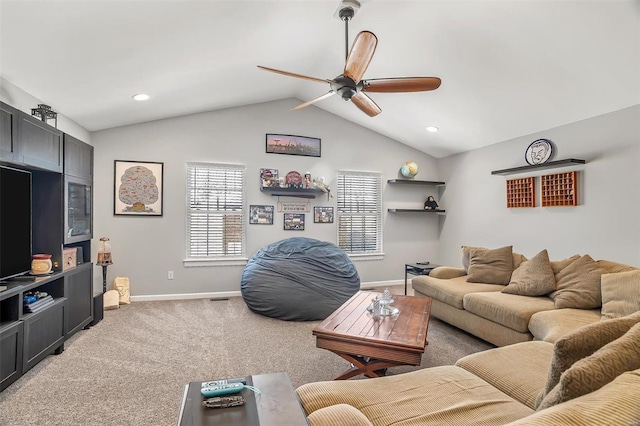 living room featuring ceiling fan, carpet, and lofted ceiling