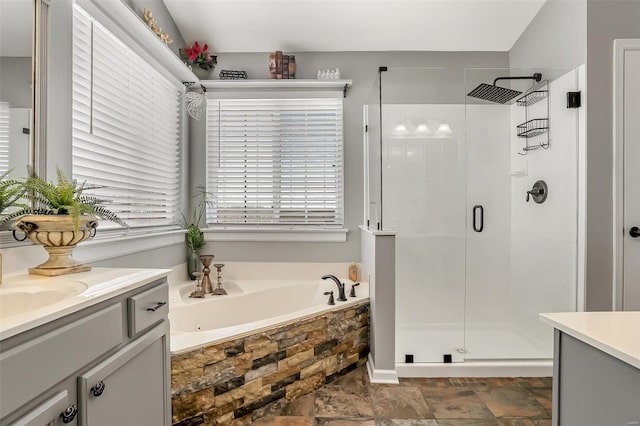 bathroom with plus walk in shower and vanity