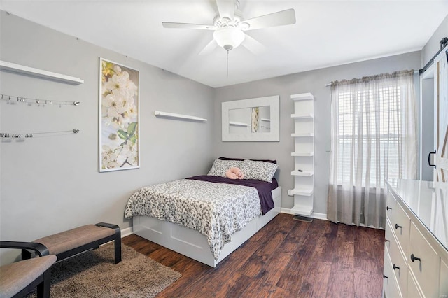 bedroom featuring dark wood-type flooring and ceiling fan