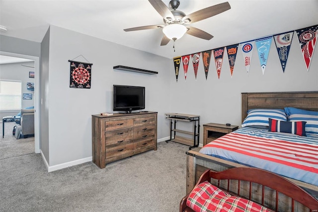 bedroom with light carpet and ceiling fan