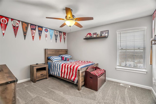 bedroom featuring ceiling fan and carpet