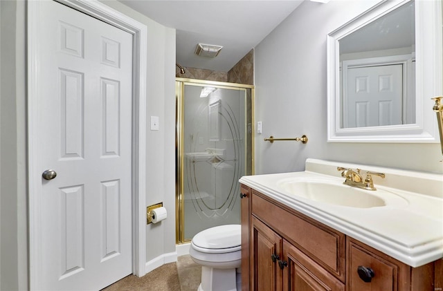 bathroom featuring vanity, toilet, and an enclosed shower