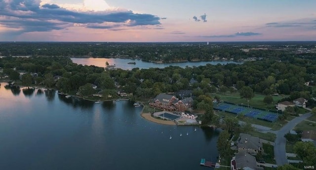 aerial view at dusk with a water view