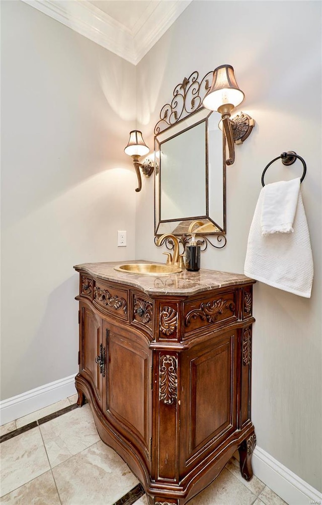 bathroom with tile patterned flooring, vanity, and crown molding