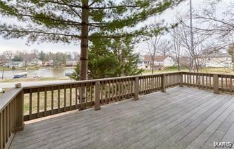 wooden terrace with a water view