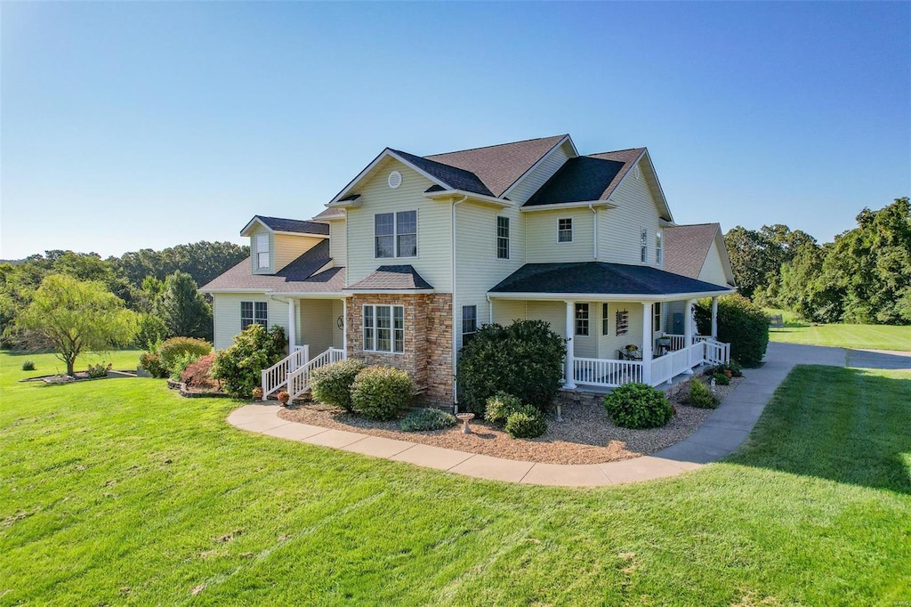 view of front of home featuring a porch and a front yard