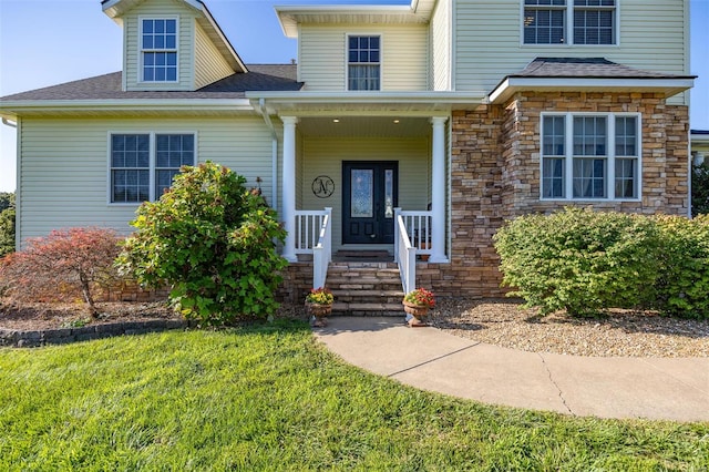 view of front of house featuring a front lawn and a porch