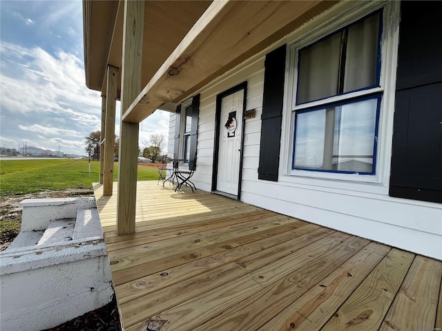 wooden terrace with a porch