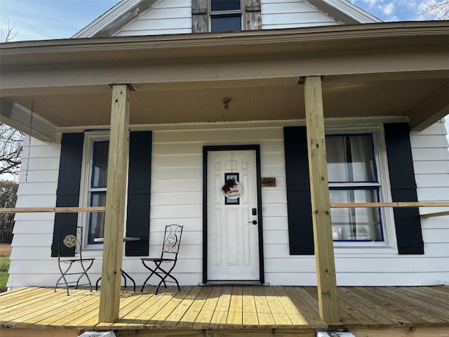 doorway to property featuring covered porch