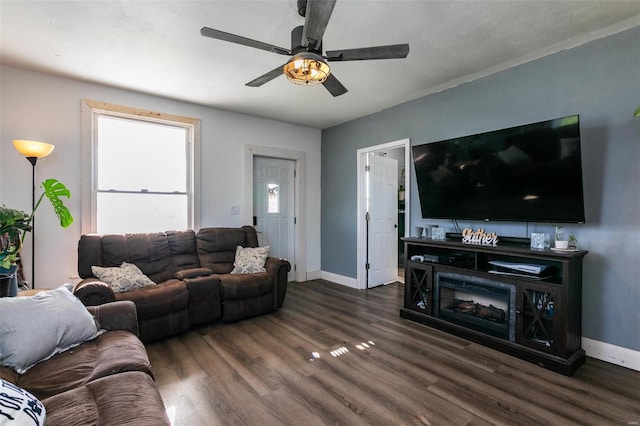 living room featuring dark hardwood / wood-style floors and ceiling fan