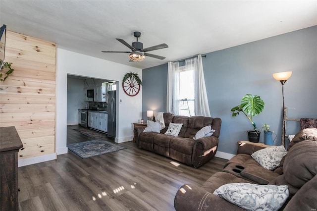 living room featuring dark hardwood / wood-style floors and ceiling fan