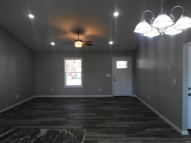 entryway featuring dark hardwood / wood-style floors and ceiling fan with notable chandelier