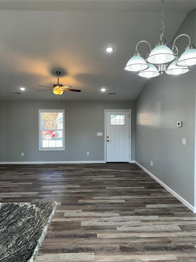 foyer with dark hardwood / wood-style flooring, vaulted ceiling, and ceiling fan