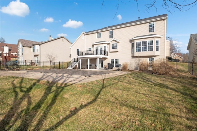 back of property with stairs, a patio, fence, and a lawn