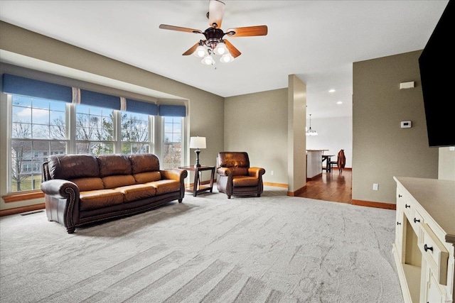 living room featuring visible vents, baseboards, carpet flooring, recessed lighting, and a ceiling fan