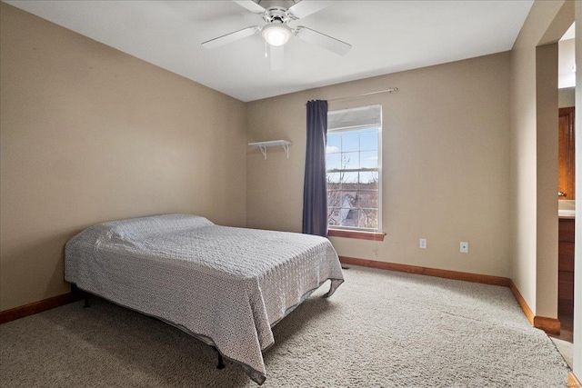 bedroom with a ceiling fan, baseboards, and carpet floors