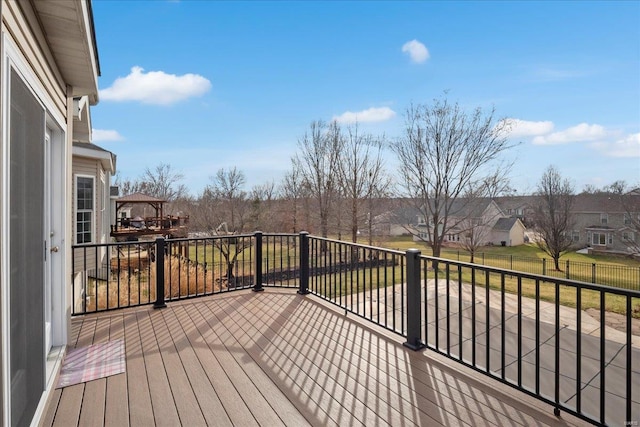 wooden terrace with a residential view