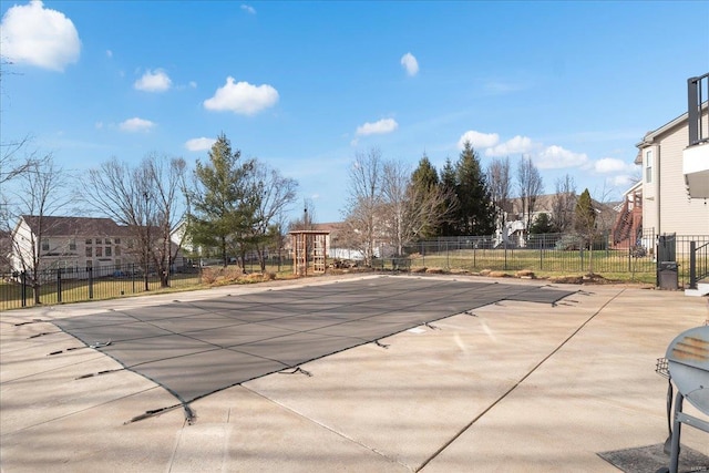 view of swimming pool with a patio area, a fenced in pool, and fence