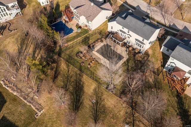 birds eye view of property with a residential view