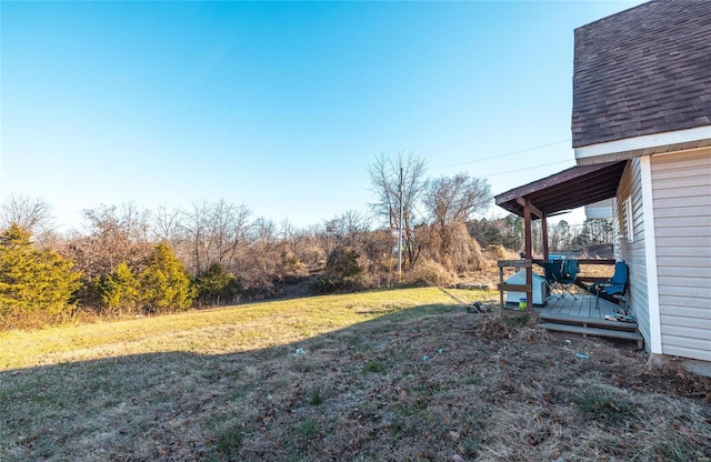 view of yard featuring a wooden deck