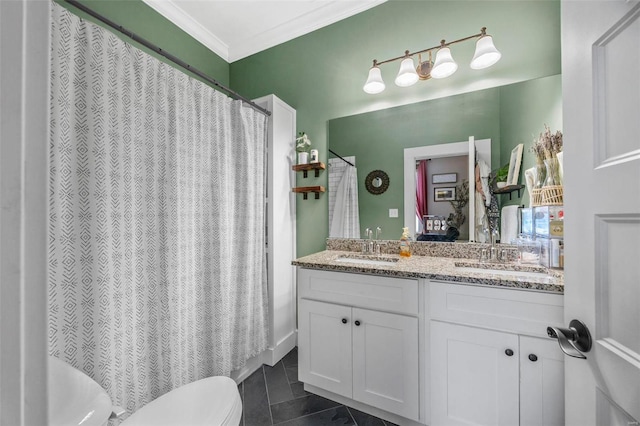 bathroom with tile patterned floors, toilet, vanity, and ornamental molding