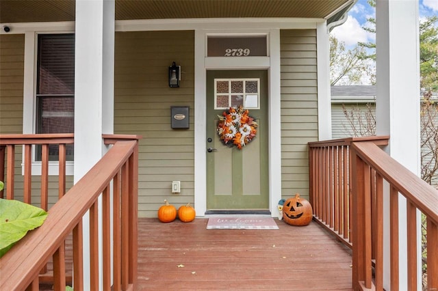 doorway to property featuring a porch