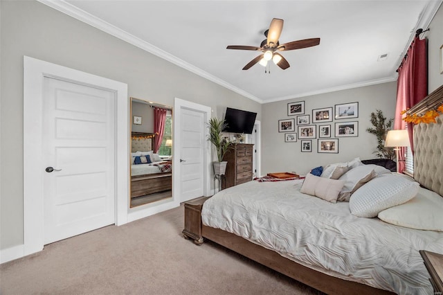 bedroom with ornamental molding, carpet flooring, ceiling fan, and visible vents