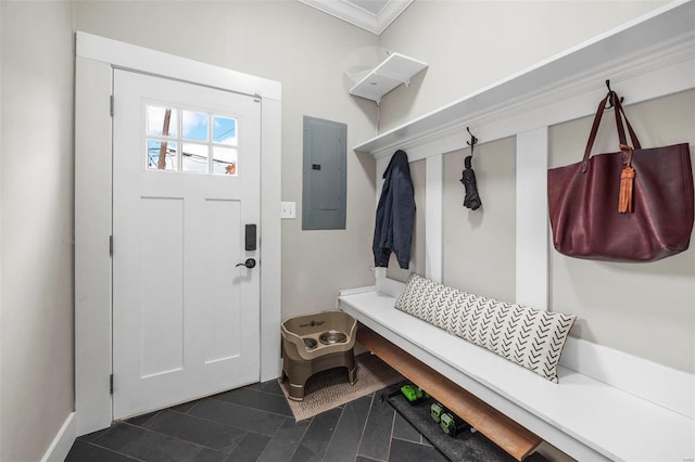 mudroom with dark tile patterned floors, electric panel, and crown molding