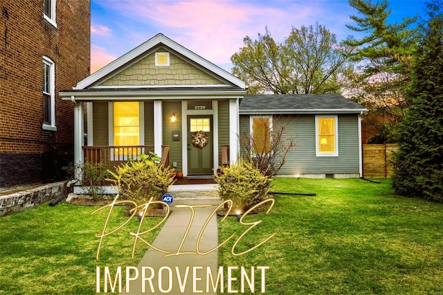 view of front of house featuring covered porch, crawl space, and a front yard