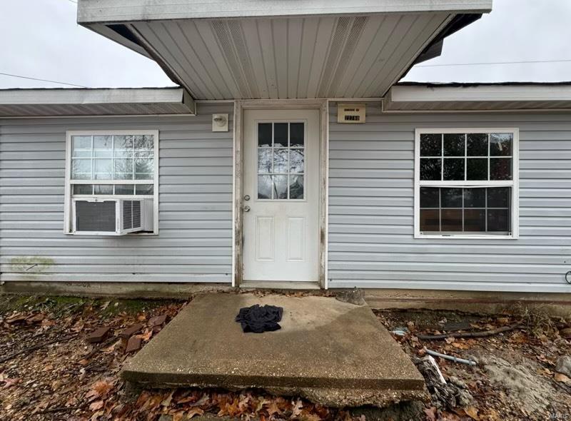 property entrance with cooling unit