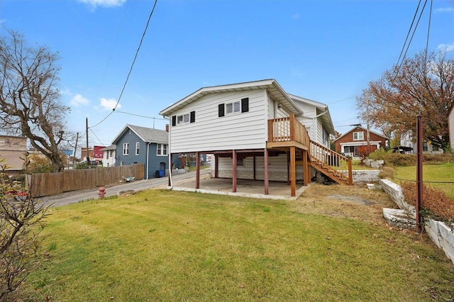 back of house featuring a yard and a patio area