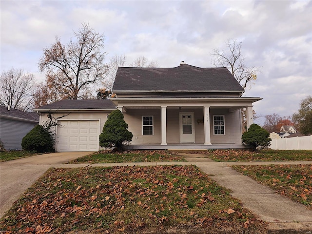 view of front of house featuring a porch and a garage