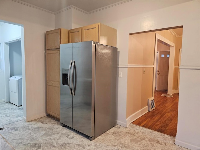 kitchen featuring light brown cabinets, crown molding, stainless steel refrigerator with ice dispenser, light hardwood / wood-style floors, and washer / clothes dryer